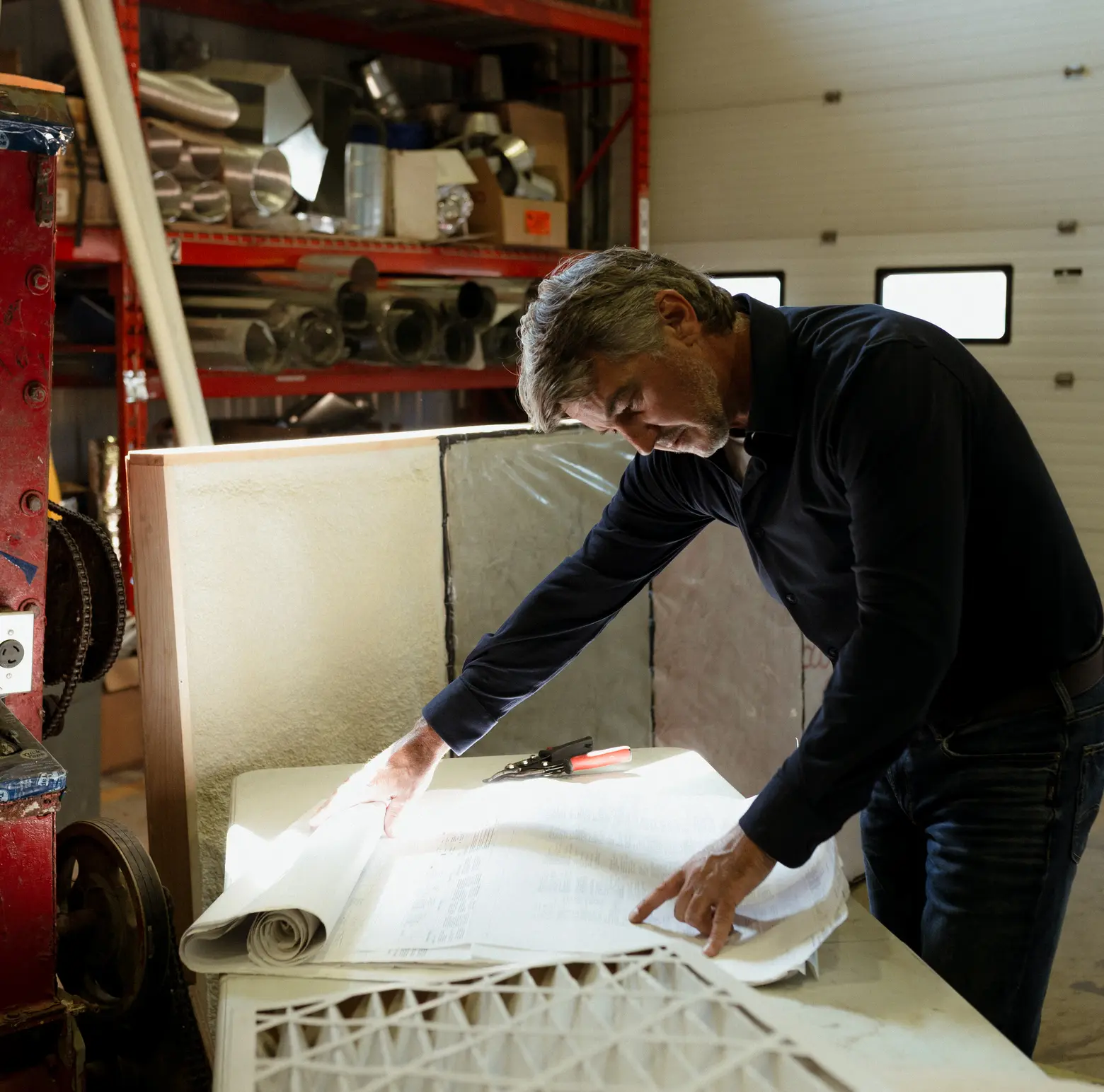 A cropped photo of a Blouin Brothers technician conducting an inspection.